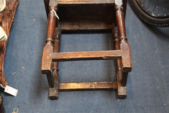 A 17th century oak joynt stool, incised with the initials W. R. 1ft. 7in. H.1ft 9in.